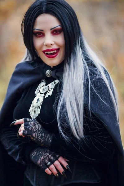 Depositphotos 223354620-stock-photo-photo-of-smiling-vampire