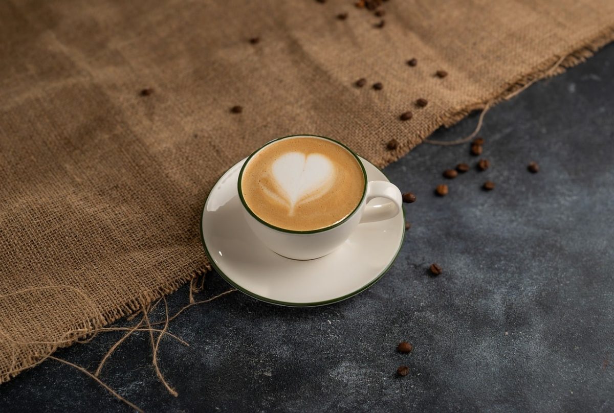 coffee, latte art, cup, heart, coffee beans, burlap surface, casual, hot drink, hot coffee, white and brown, fabric, coffee cup, acorns, rustic photography, cozy, coffee shop, woody ambiance, relaxed ambiance, barista