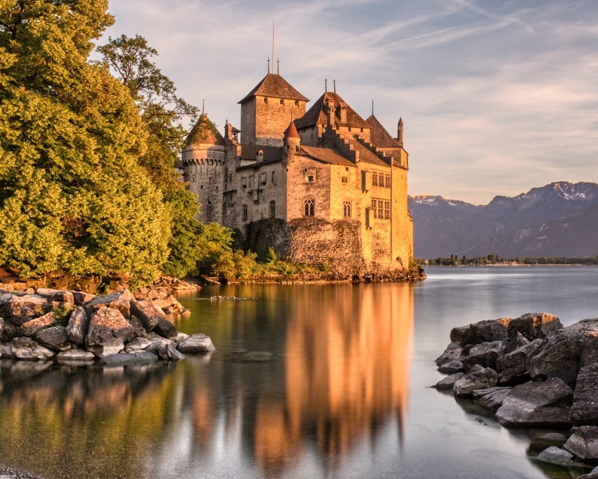 switzerland, montreux, castle, lake, landscape, sunset, reflection, lake geneva, historic, tourist attraction, architecture, water, rock, nature, spring, tree, glow, peaceful, romantic, travel