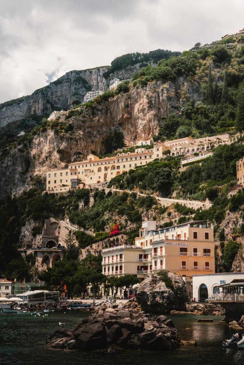 amalfi, coastal town, italian architecture, mediterranean, colorful houses, tourist destination, rocky cliff, italy vacation, scenic beauty, vacation spot, photogenic, cobbled streets, italy, tourist footprints, hilly hills, fall, relaxation, marine vibe, river mouth, mediterranean vegetation