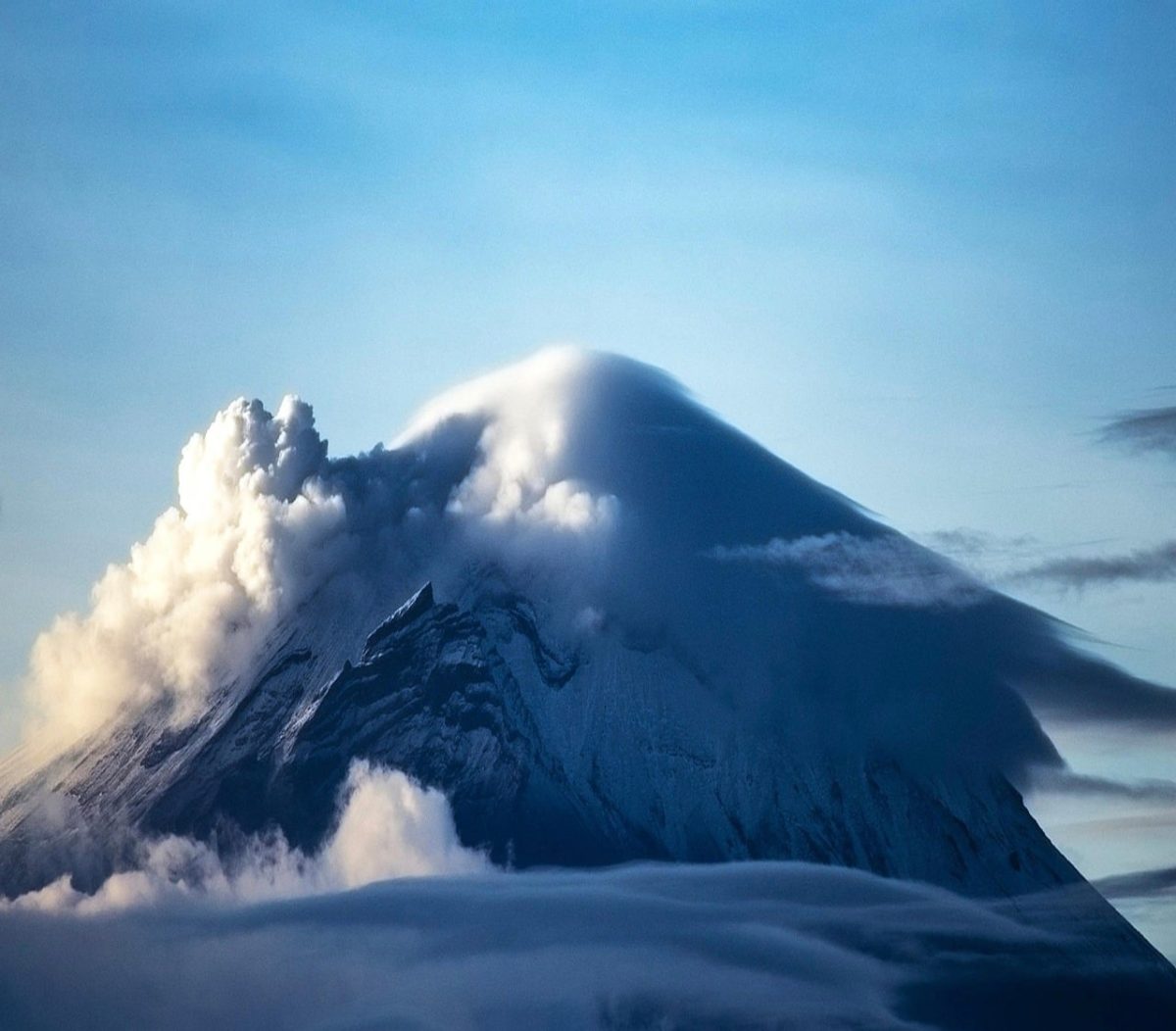 mountain, nature, landscape, volcano, smoke, clouds, summit, blue sky, daytime, majestic, winter, geology, natural force, dramatic, scenery, awe-inspiring, pristine, lonely, rawness