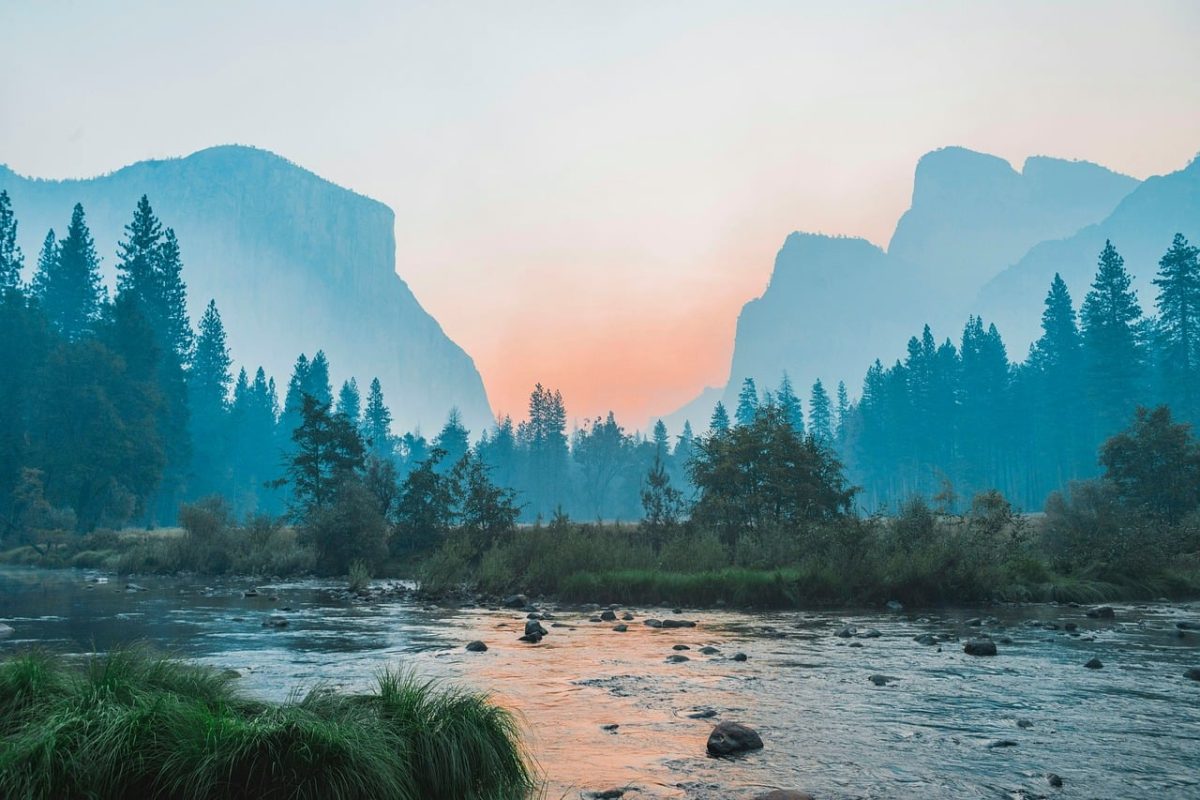 sunset, landscape, mountains, forest, nature, golden hour, scenic view, peaceful, evening sky, sun rays, travel, wilderness, river, valley, tourist destination, nature reserve, camping, light effects, dawn, morning