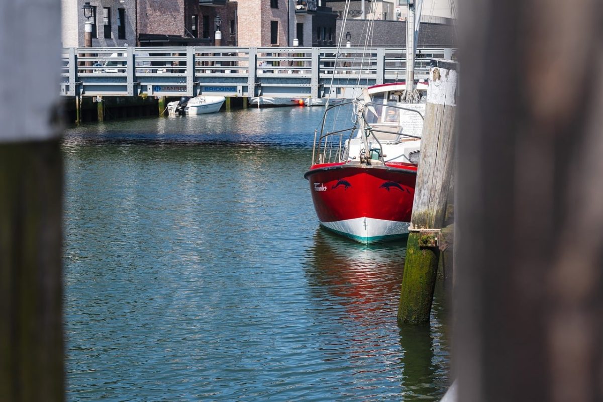 motorboat, red, harbor, sea, yacht, water, sailboat, bridge, cityscape, boat harbor, architecture, boom, mooring, sunny, outdoor, urban area, navigation, summer day, small vessel, relaxation, pier