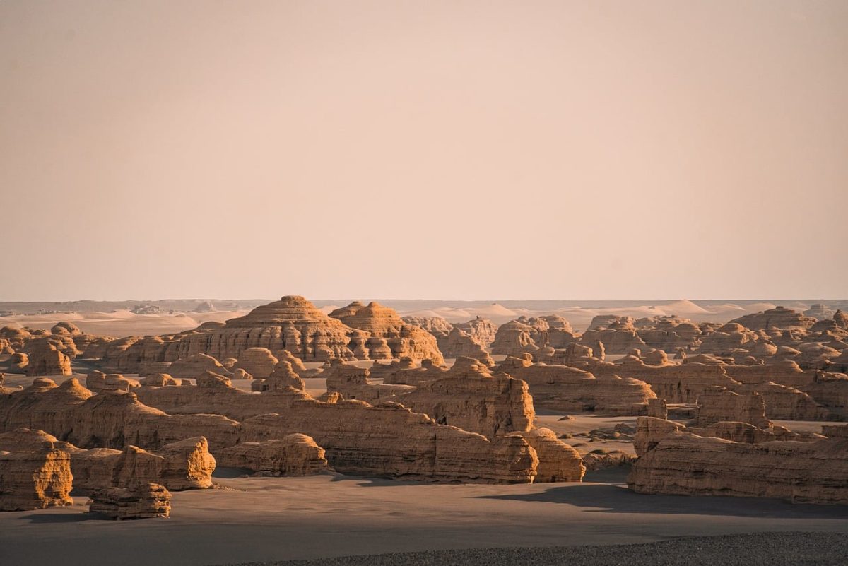 desert, rock formations, nature, sand, natural scenery, desert landscape, dryness, sunset scene, warm colors, vastness, silence, evening light, natural beauty, adventure, hiking, outdoor, tourism, emptiness, calmness, natural monument, four seasons
