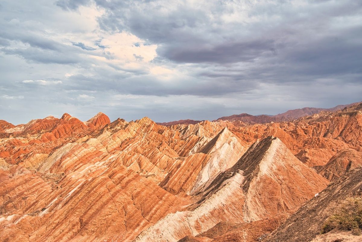 geological formation, mountains, nature, rock formations, colorful layers, sky, nature escape, dramatic sky, tourism, natural wonders, rocky mountains, sand landscape, red-white, dry terrain, panoramic photograph, chinese landscapes, urban parks, landscape without plants, cultural heritage, natural monument