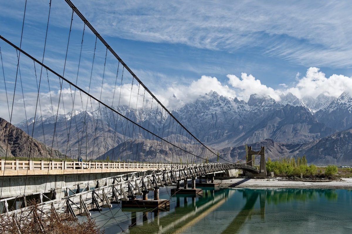 pakistan, bridge, river, mountain range, karakoram, khaplu, snow, nature, mountains, sky, clouds, reflections, shyok river, suspension bridge, northern pakistan, outdoor tourist attractions, tourism, water surface, landscape