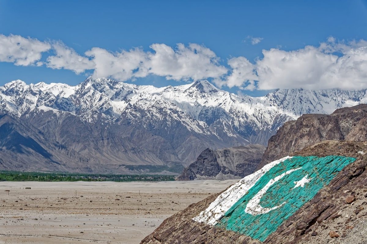 pakistan, gilgit-baltistan, karakoram, mountains, snow, landscape, nature, clouds, sky, rocks, flag, pakistani flag, karakoram mountains, snow-capped mountains, majestic nature, hiking, panorama, terrain, natural beauty