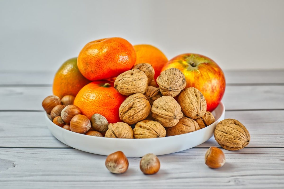 fruit, tangerines, apple, walnuts, hazelnuts, wood, plate, white background, wooden table, fresh food, healthy diet, autumn, vitamins, snack, vegetarianism, natural foods, nuts, dining, wooden floors