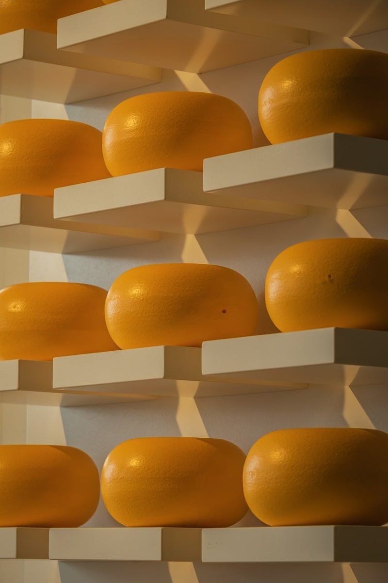 cheese, shelves, cheese storage, round shape, aged cheese, light and shadow, workshop, dairy production, artisanal cheese, cheese factory, textural form, indoor lighting, exposure, industry, food industry, cheese care, processing, product, milk, indoor