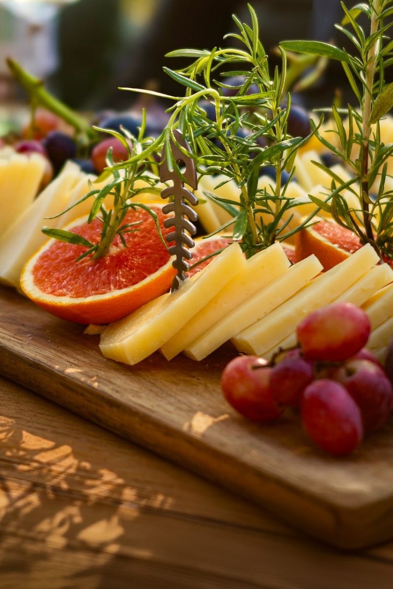 cheese plate, grapes, grapefruit, rosemary, wooden board, tray, cheese, tasty, antipasti, appetizers, herbs, snack, gouda, food, gourmet, slices of cheese, wine festival, fresh ingredients, gourmet catering, table hospitality