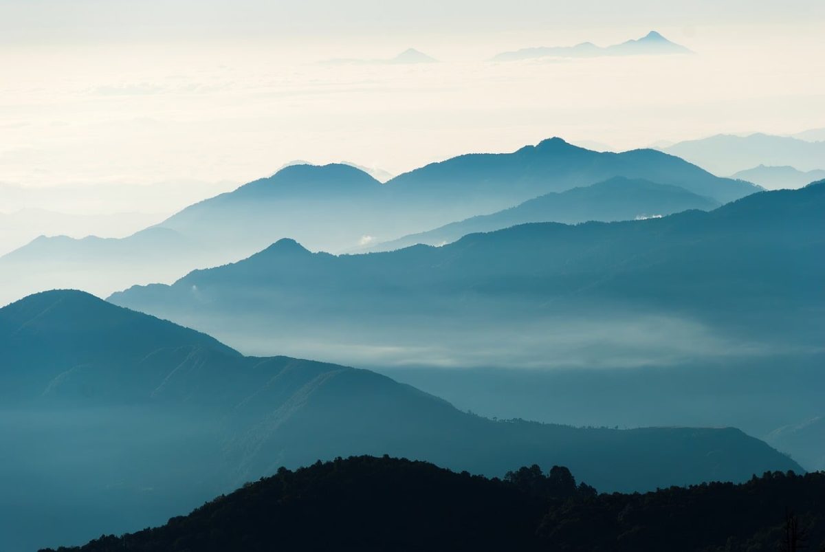 nepal, annapurna circuit, poon hill trek, dawn, morning mist, sea of clouds, layered mountains, blue tone, mountain silhouette, himalayan peaks, fog valley, alpine landscape, trekking, mountain panorama, atmospheric haze, landscape photography, sunrise preview, mountain layers