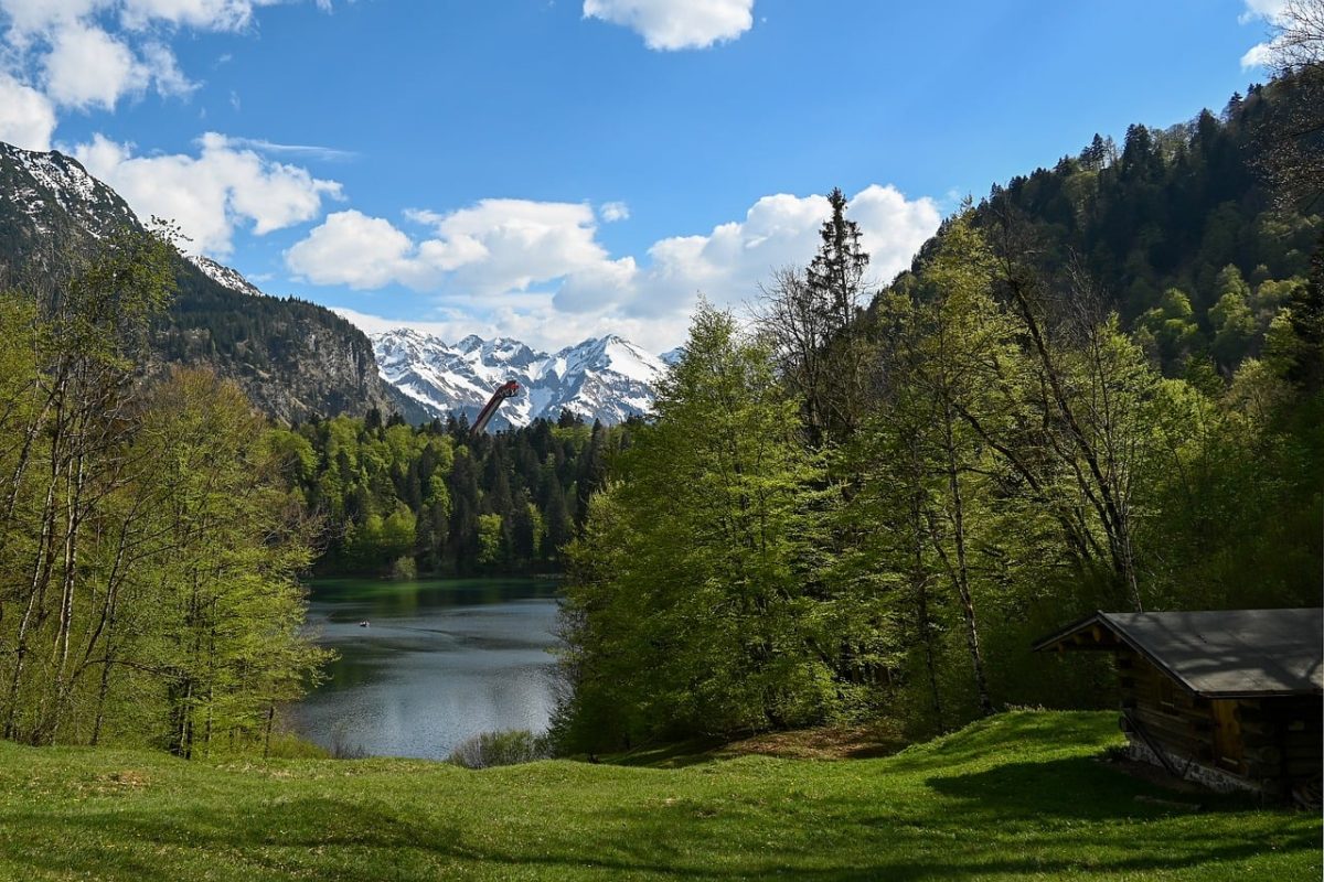 oberstdorf, freibergsee, spring, mountains, alps, allgäu, landscape, alpine mountains, light, nature, lake, allgäu alps, hiking, vacation, lake freiberg, ski jump, grass, blue sky, lush, wooden cabin