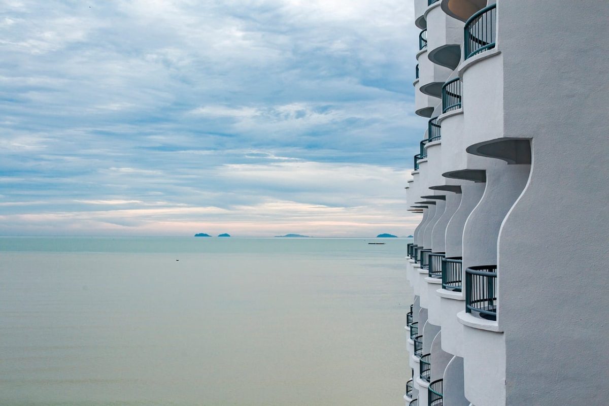 penang, malaysia, coastal building, curved balcony, sea landscape, calm sea, nature, distant islands, cloudy sky, architecture photography, modern architecture, sea view, extreme angle, luxury hotel, ocean, clear sky, coast, tranquility