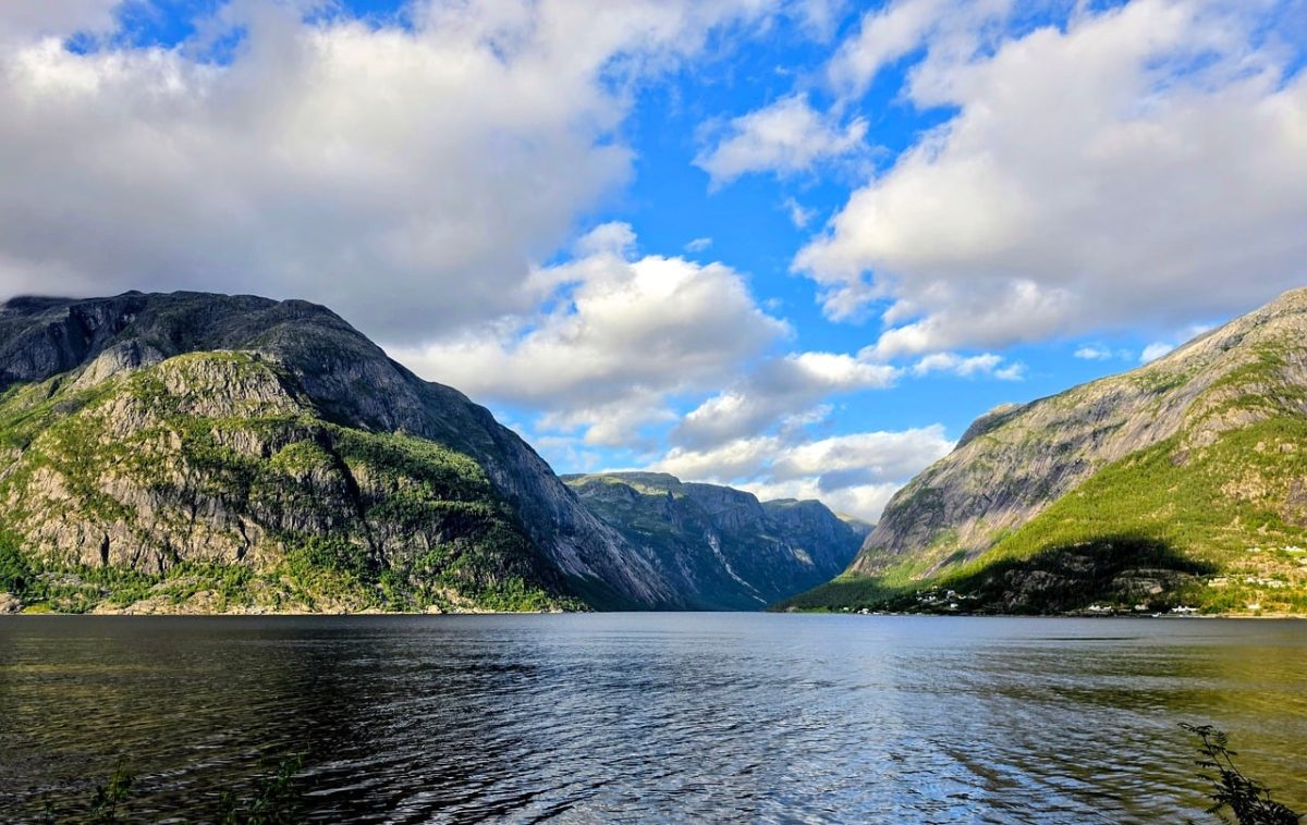 fjord, norway, mountains, water, sky, clouds, landscape, sun, nature, calm, serenity, majestic, tourism, natural beauty, summer day, coastal landscape, peace, view, panoramic, blue sky, Norway, Vestland, Eidfjord