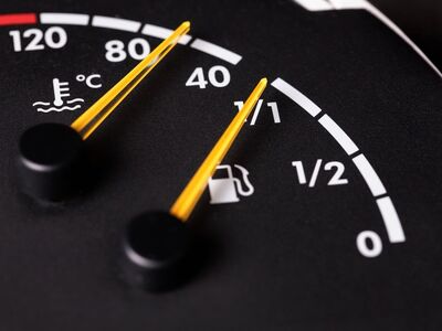 fuel gauge, thermometer, temperature symbol, gauge, zero, degree, analog display, dashboard panel, black color, yellow needle, motor vehicle, dashboard, vehicle control, fuel level indicator, mechanical measurement, forty, fuel tank, temperature scale, five