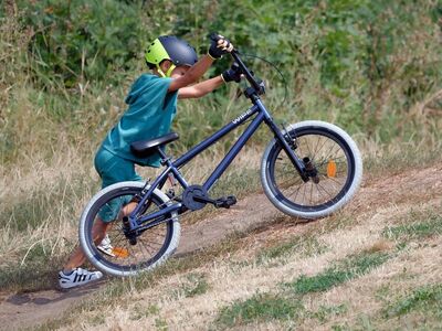 child, bicycle, helmet, green, grass, outdoor, child pushing bicycle, active, adventure, childhood, boy, safety, summer, exercise, effort, active child, youth, sports activities, blue bicycle, outdoor adventure, carefree