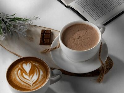 coffee, hot chocolate, latte art, book, chocolate, light, café, relaxation, reading, coziness, aroma, warm, wooden tray, calm atmosphere, white color, natural materials, comfort, board