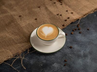 coffee, latte art, cup, heart, coffee beans, burlap surface, casual, hot drink, hot coffee, white and brown, fabric, coffee cup, acorns, rustic photography, cozy, coffee shop, woody ambiance, relaxed ambiance, barista