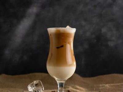 iced coffee, cold drink, coffee bean, ice, glass, beverage, table, cafe vibe, coffee with milk, foam, brown color, burlap, light brown tones, contrast, black background, artistic photography, still life, winter drink