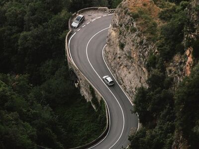 winding road, wooded area, car, rocky area, forest, nature, car wallpapers, road, transportation, tourist attraction, view, road traffic, light green, panorama, highway, coastal landscape, guidance, elevation, ecology, green trees, cave, fresh air, natural reserve