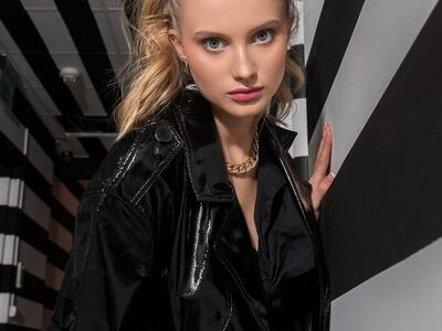 woman, fashion, model, blonde, black jacket, ponytail, makeup, eyes, fashion photography, striped wall, necklace, glamorous, woman portrait, artificial lighting, shiny material, chain, beautiful, styling, young woman, naturalness, modern
