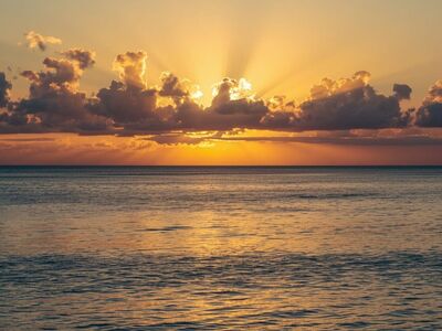 sunset, ocean, calm water, sun rays, reflection, calm atmosphere, natural beauty, landscape, zen, evening sky, nature, serenity, travel destination, peaceful nature, mental health, golden hour, tranquil sea, meditation, horizon, relaxation, well-being