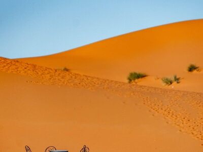 desert, dune, table set, blue sky, chair, morocco, dining, sand, nature, sunlight, warm, hiking, adventure, vacation, outdoor, tranquility, relaxation, natural scenery, rest, comfort, view