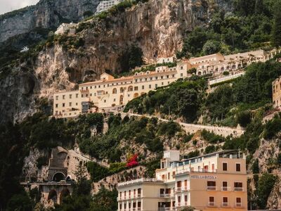 amalfi, coastal town, italian architecture, mediterranean, colorful houses, tourist destination, rocky cliff, italy vacation, scenic beauty, vacation spot, photogenic, cobbled streets, italy, tourist footprints, hilly hills, fall, relaxation, marine vibe, river mouth, mediterranean vegetation