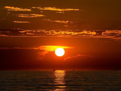 sunset, nature, landscape, sea, horizon, beach, water, seascape, evening, west, red, orange, boat, reflection, stunning, peaceful, sunset on beach, scenic beauty, clouds, golden hour