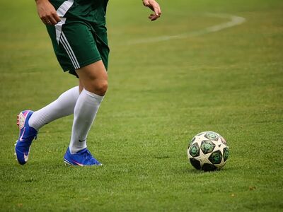 soccer, player, green, uniform, shoes, nature, lawn, footballer, grass, cleats, kick, sport, blue, ball, motion, white socks, football field, action, sports equipment