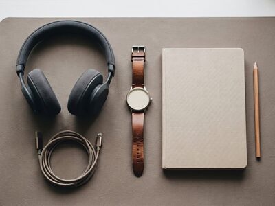 headphones, notebook, watch, pencil, leather strap, organization, minimalist, desktop, style, work desk, charging cable, technology, accessory, arrangement, modern, details, aesthetics, workspace, elegant, office