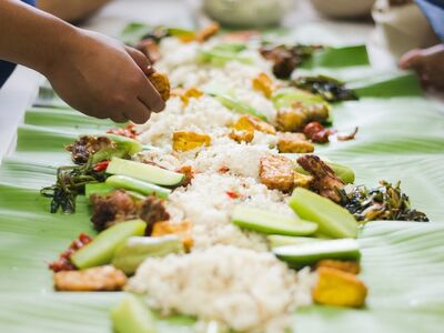 indonesian food, banana leaf, communal eating, traditional, fried chicken, tempeh, tofu, personal, rice, sambal, vegetables, water spinach, togetherness, ingredients, culture, family, eating with hands, meal, preparation, enjoyment