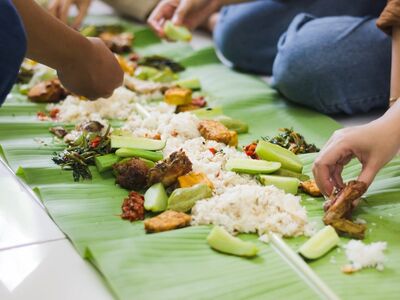 nasi liwet, indonesian food, banana leaf, tradition, tofu, tempeh, fried chicken, sambal paste, water spinach, food gathering, culture, family dinner, hands, shared meal, traditional cuisine, indonesian culture, fresh food, simplicity, indonesian cooking, communal dining