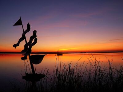 sunset, lake, reflection, evening calm, boat, water surface, ocean, silhouette, grass, art installation, orange sky, calm, nature, holiday, peaceful environment, relaxation, horizon, gentle, reeds, evening