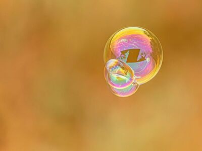 soap bubble, iridescence, reflection, floating, yellow background, macro, hd wallpaper, abstract, delicate, warm tones, spherical, background, wallpaper, round, blurred, fragile, rainbow, colorful, soft, cluster, magical