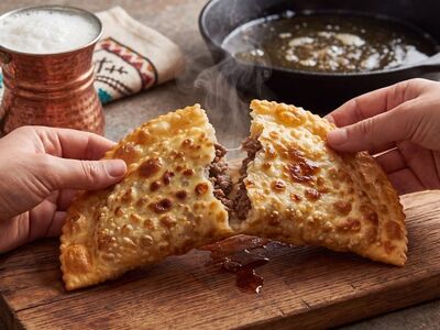 pastry, tartar, cooking, cast iron, skillet, hands, steam, watery bubble, drink, copper mug, fabric placemat, traditional design, wooden board, turkish cuisine, using uv, ethnic food, rustic, cheese, tradition, ritual, snack
