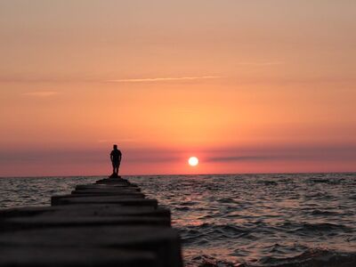 sunset, coast, sea, nature, silhouette, person, pier, sky, evening, calm, west, romantic, peaceful, beautiful, inspiring, reflections, evening sky, hiking, red sky, guide