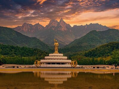 buddha statue, mountains, reflection, landmark, statue, culture, spirituality, peace, nature, sacred places, tourism, sunrise, eastern art, travel, calm, sights, zen, panoramic, religion, tranquility