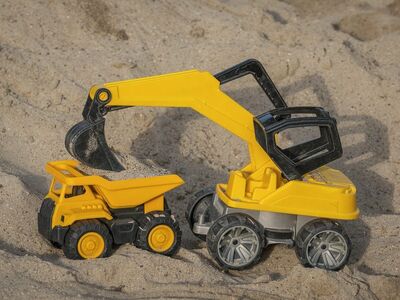 toy, excavator, sand, dumper, playing in sand, yellow color, construction site, kids' play, model, outdoor activity, building, beach toys, child's imagination, toy vehicles, outdoor play, wheels, small vehicle, interactive play, kids' excavator, play set