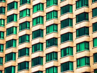 architecture, windows, modern, city, building window, glass panes, urban landscape, geometric pattern, symmetry, grid pattern, yellow, green, concrete structure, high-rise, office building, urban style, architectural design, repetitive pattern, urban architecture