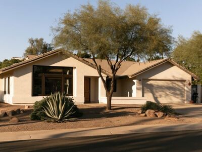 house, home, residential, modern, architecture, exterior, nature, landscaping, desert, plant, arid, sunny, light, shadow, suburban, neighborhood, front yard, agave, day, street, outdoor, property