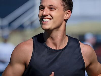 men, athlete, sport, athletic, model, body, track and field, field, competition, stadium, exercise, outdoors, athletics, pose, photoshoot, smile, posing, fitness, sweat, corridor, influencer, headshot