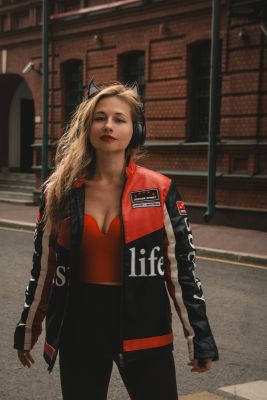 woman, motorcycle jacket, horns, music headphones, portrait, summer, classic, nature, romantic, model, posing, femininity, cheeky, beautiful