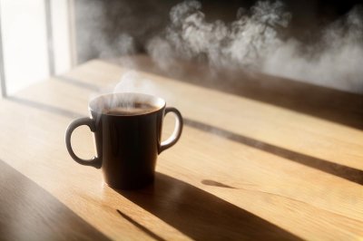 coffee, breakfast, morning, cup, steam, coffee cup, hot, caffeine, table, sunlight, wood, lifestyle, cozy, drink, espresso, latte, aroma, relaxation, shadow, window, mug, interior, beverage, still life, minimalist, atmosphere, ai generated