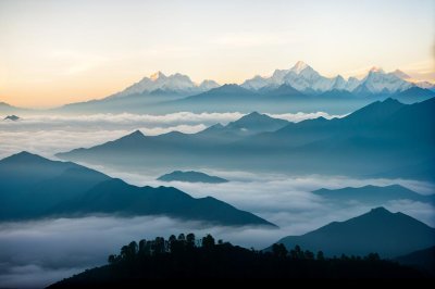 nepal, annapurna circuit, poon hill trek, dawn, morning mist, sea of clouds, layered mountains, blue tone, mountain silhouette, himalayan peaks, fog valley, alpine landscape, trekking, mountain panorama, atmospheric haze, landscape photography, sunrise preview, mountain layers